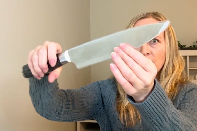 Holding the Cutluxe 8 inch chef knife