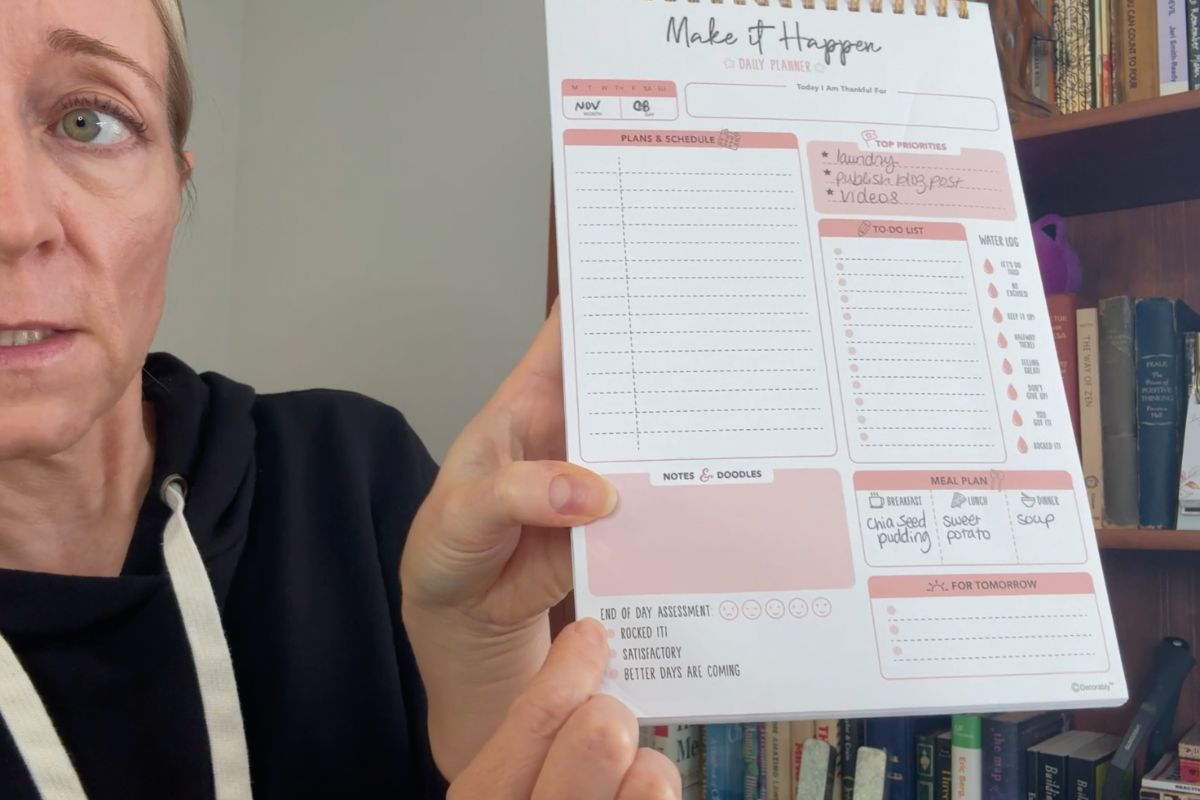 Holding a decorably daily planner pad