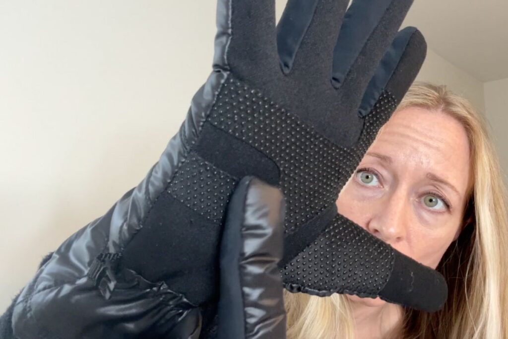 Pointing to the grips on the glove