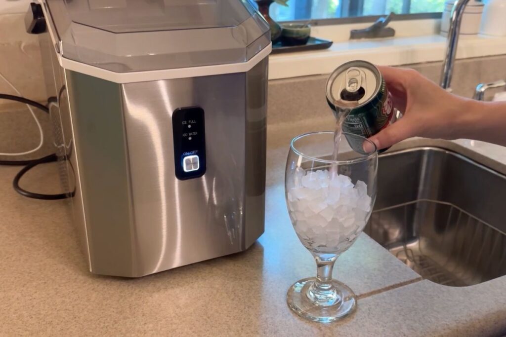 Pouring a drink into a glass of nugget ice