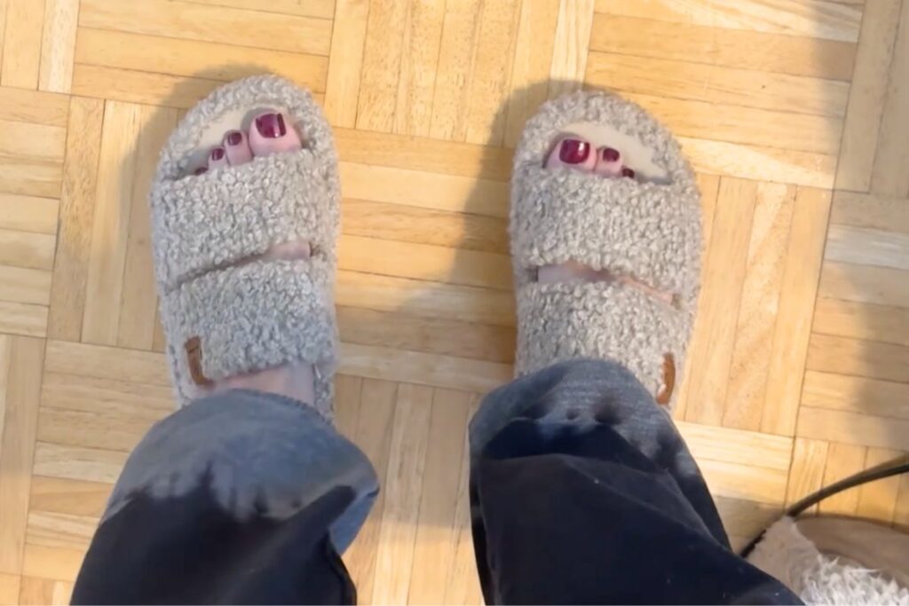 Wearing fuzzy open toe slipper sandals