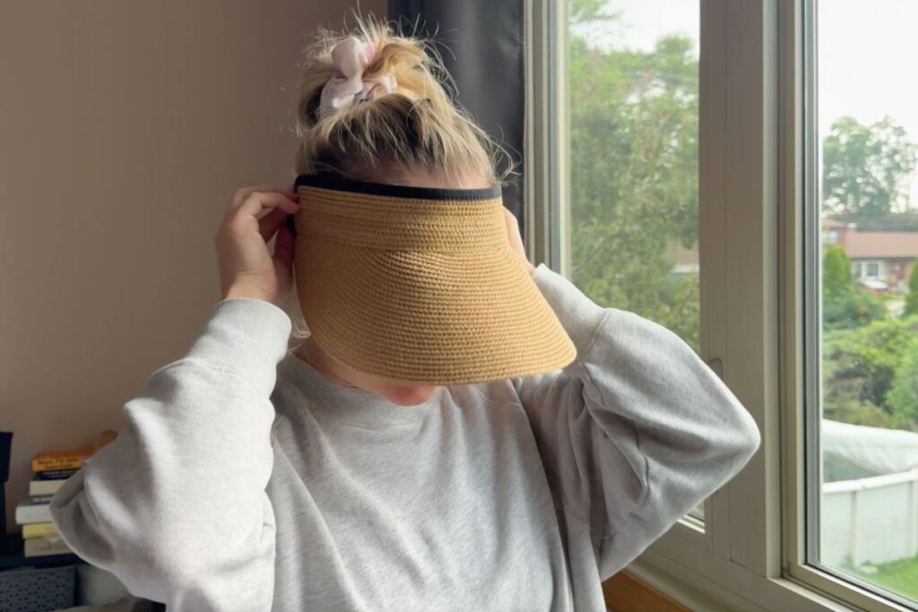 Shelley wearing a sun visor