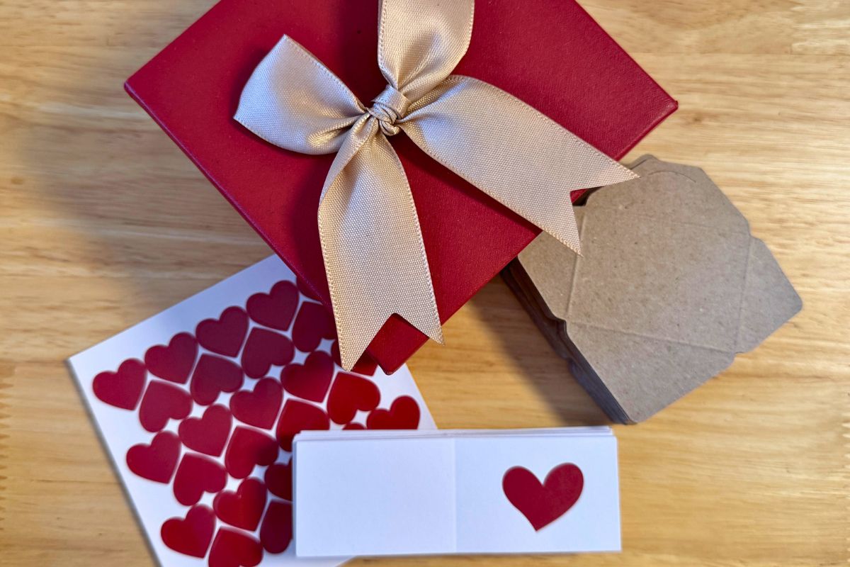 box with a bow and tiny blank love note cards