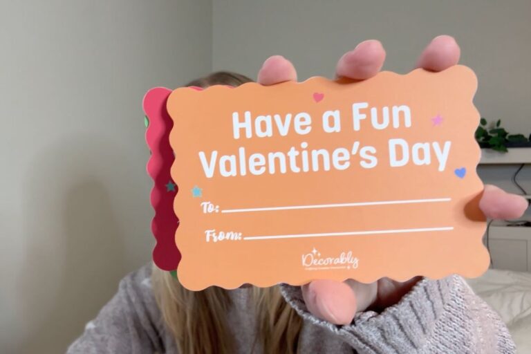 Holding a Valentine's postcard