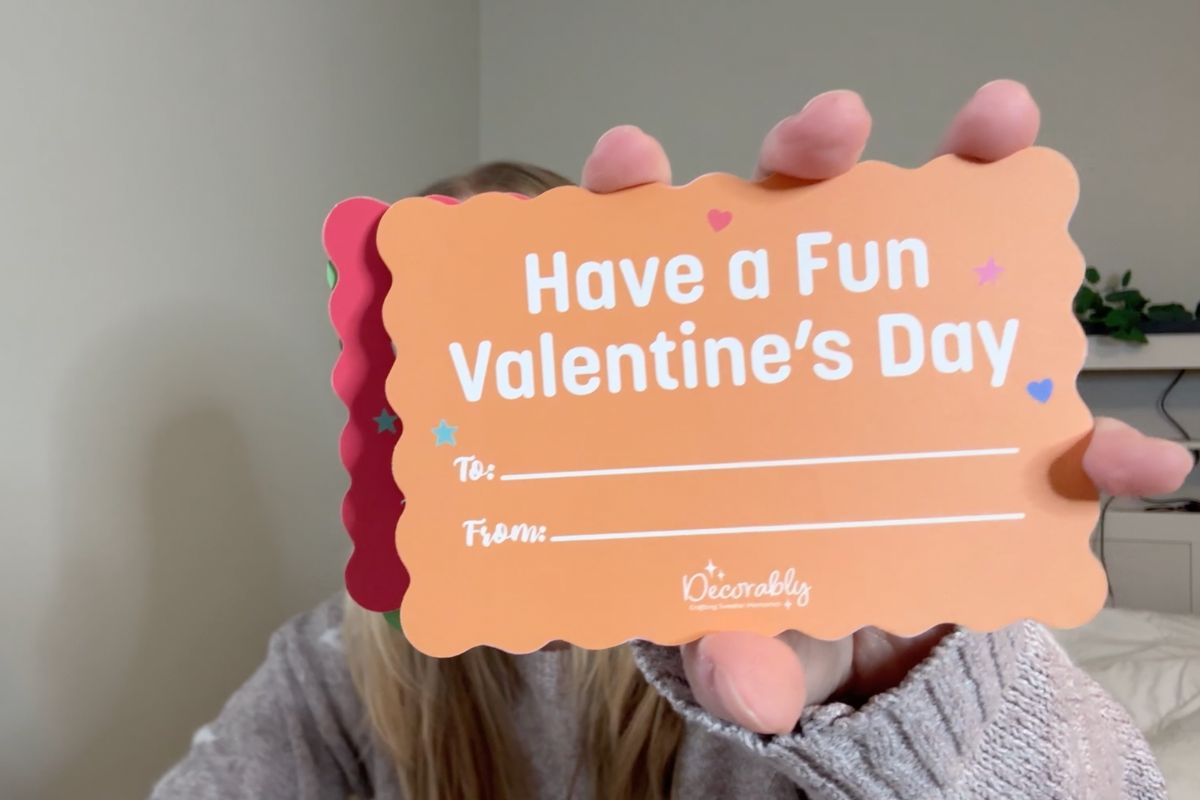 Holding a Valentine's postcard