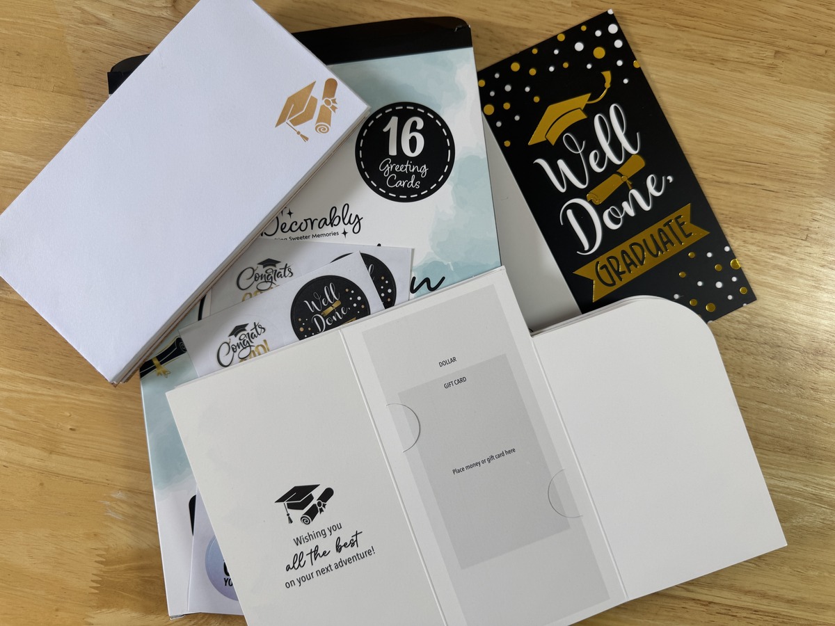 Decorably 16-pack graduation card set with sample Well Done Graduate card and open card displayed