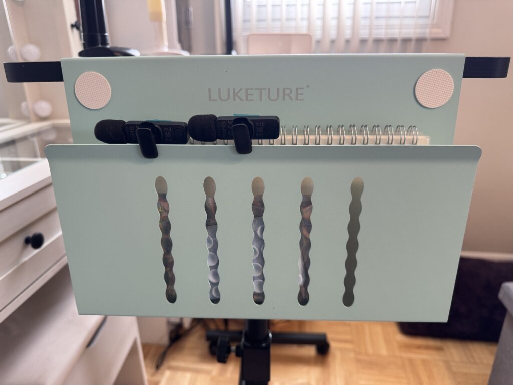 Luketure mint green diamond painting drill pen stand holding five decorated pens on a spiral notebook clipboard.