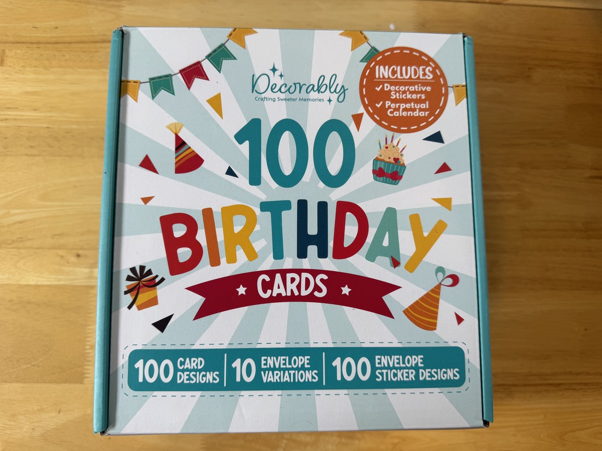 Decorably 100 Birthday Cards boxed set front, includes decorative stickers and perpetual calendar.