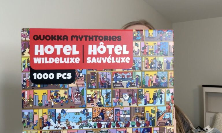 Quokka Mythtories Hotel Wildeluxe 1000-piece jigsaw puzzle box with colorful cartoon hotel scene illustration.
