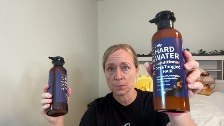 AHSUO hard water shampoo and conditioner bottles held side by side, labels reading Daily Hard Water for dry and tangled hair in eucalyptus mint