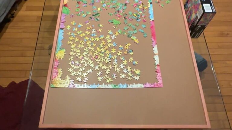 Bits and Pieces Jumbo Puzzle Plateau Lounger on a glass coffee table with a 1,000 piece puzzle in progress, wood frame and raised edge