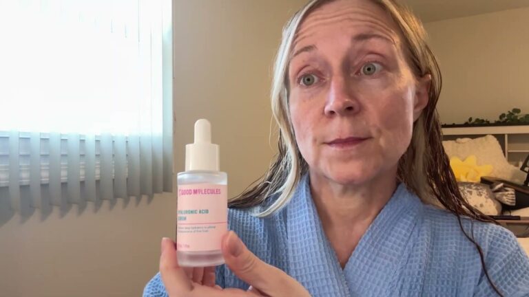 Jen holding a frosted Good Molecules Hyaluronic Acid Serum bottle with a white dropper cap, label facing the camera