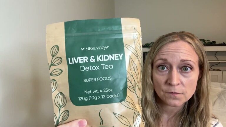 Jen holding the MKSUVGQ Liver and Kidney Detox Tea bag, green label on a kraft pouch, 120 g, 12 packs