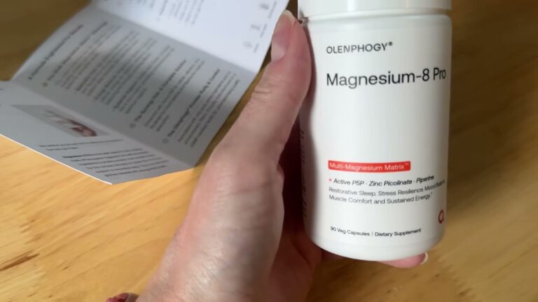 Olenphogy Magnesium-8 Pro white supplement bottle held in front of the folded informational pamphlet that comes in the box