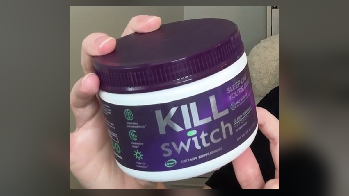 SWITCH Killswitch sleep formula hot cocoa, a purple and white canister held up to the camera