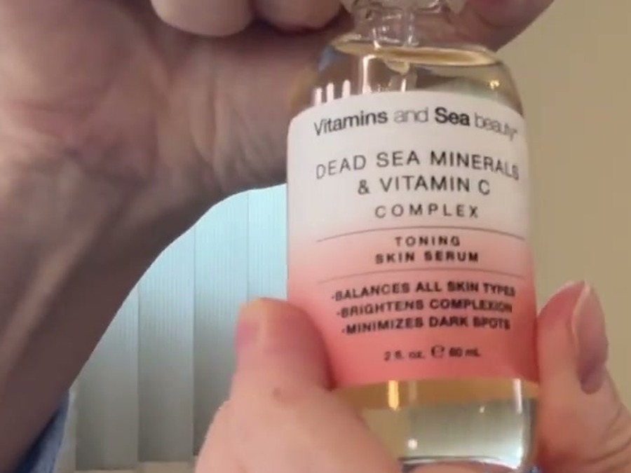 Close-up of the Vitamins and Sea Beauty serum label reading balances all skin types, brightens complexion, minimizes dark spots, 2 fl oz