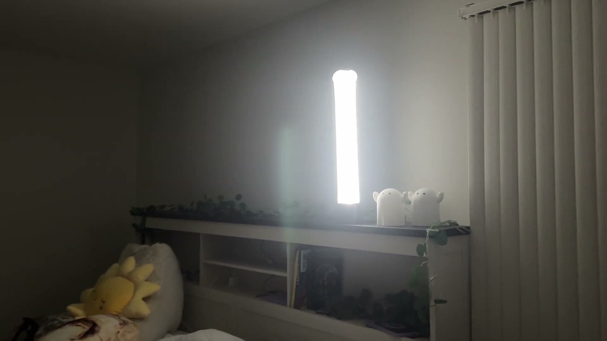 BILTRTE lantern glowing on a headboard shelf and lighting up a dark bedroom during a power outage