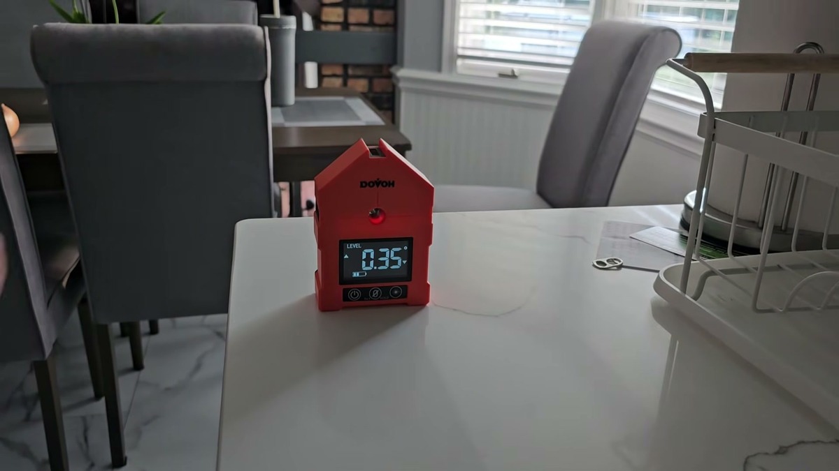DOVOH WG-3L digital angle finder standing on a white kitchen counter with the screen reading 0.35 degrees