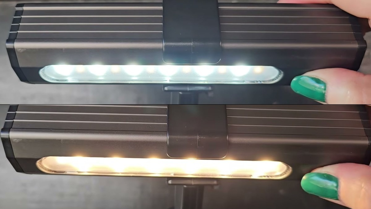 Two views of the same grill light, the top glowing cool white and the bottom glowing warm yellow after holding the button to change color