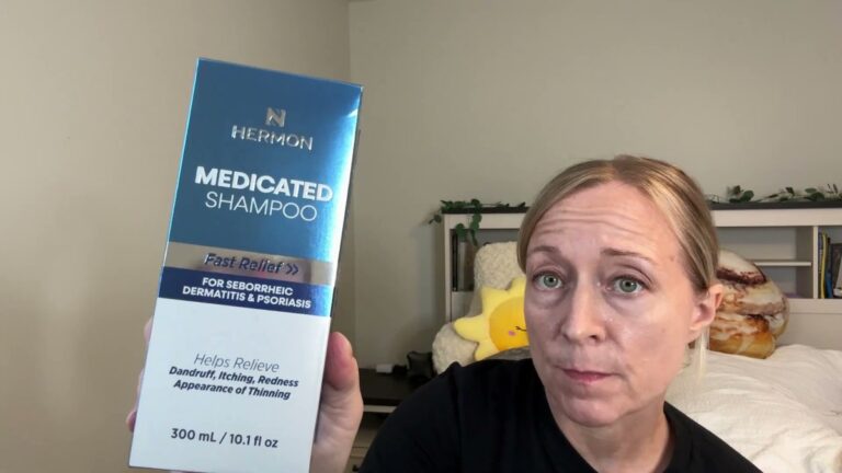 Jen holding up the blue and white Hermon Medicated Shampoo box, which reads Fast Relief for Seborrheic Dermatitis and Psoriasis, 300 mL
