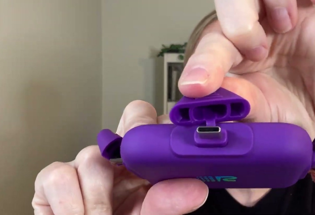 Close-up of the purple Rush Charge Universe power bank with its attached cap flipped up to show the built-in USB-C tip