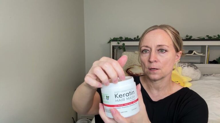 Jen holding up a white SUNATORIA Deep Conditioning Keratin Hair Mask jar with a red stripe and green leaf logo