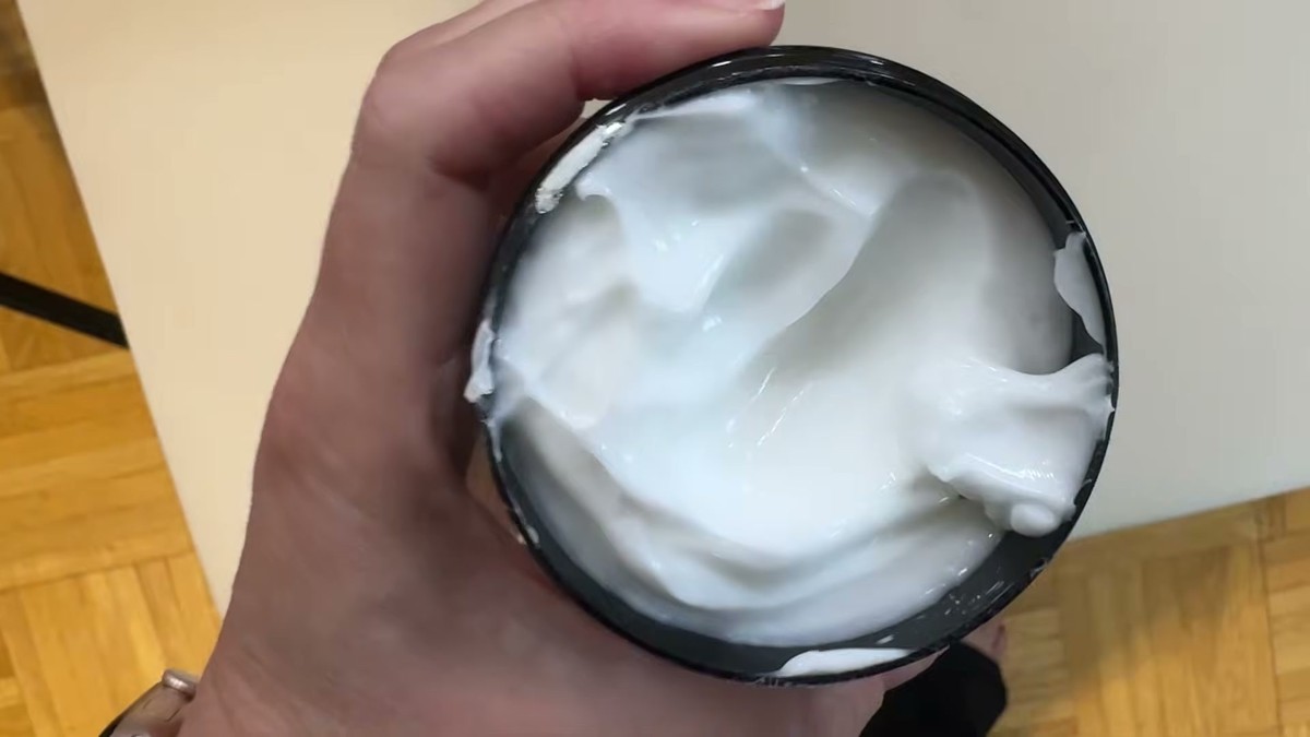 Open tub of VREKEF 60% urea cream showing the thick, white, creamy texture inside