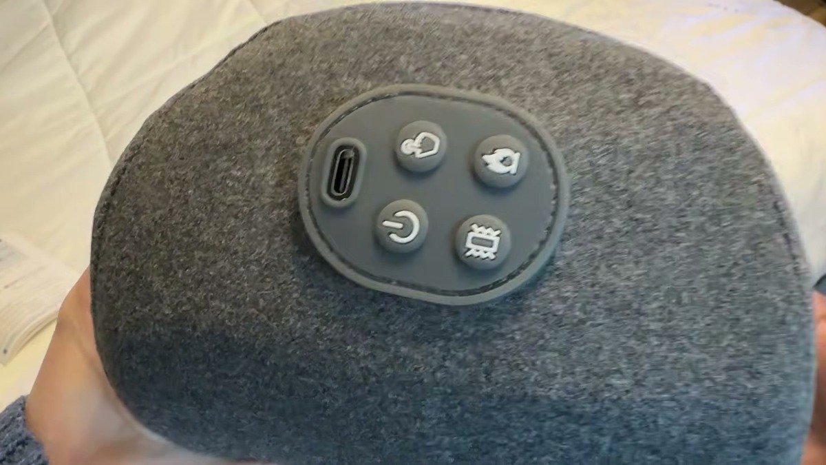 Side of the Zenvita neck massage pillow showing the USB-C charging port and four control buttons